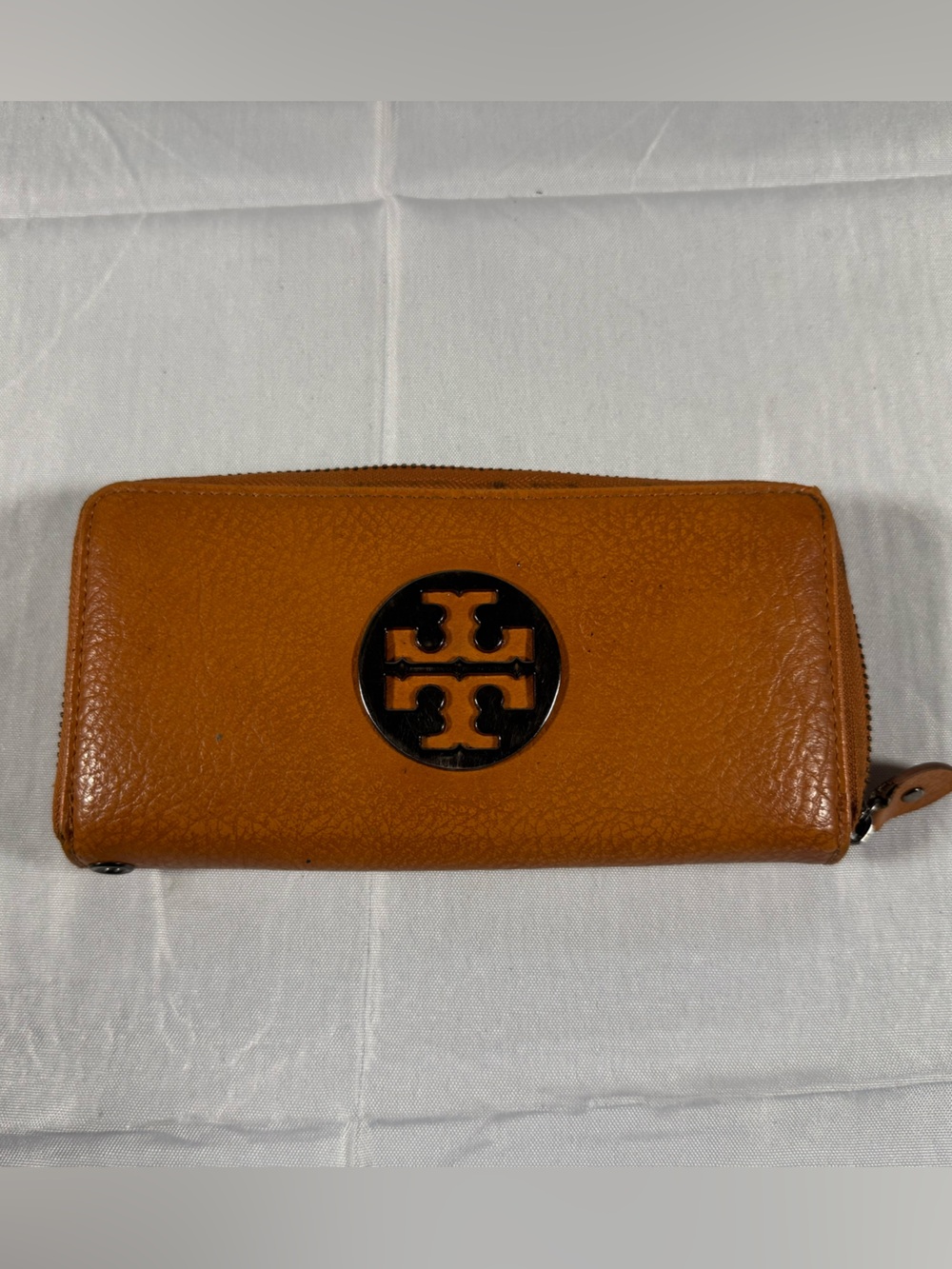 Tory Burch cognac brown leather zip-around wallet with pebbled texture